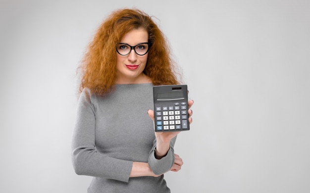 Image result for gorgeous redhead using calculator