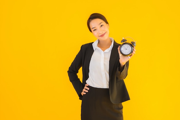 portrait beautiful young asian woman show clock alarm 74190 10483 - Bagaimana Cara Mengurus Visa Kerja ke Malaysia? Ini Infonya