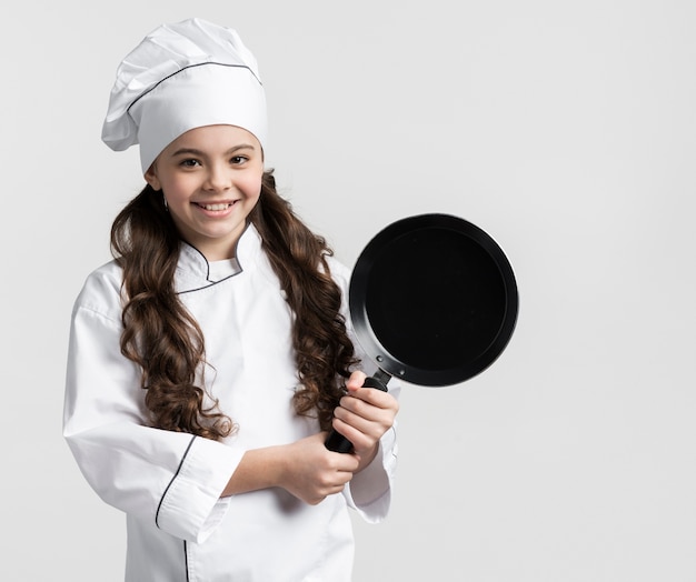 Beautiful Woman Cooking Gas Portrait of beautiful young girl holding cooking pan 