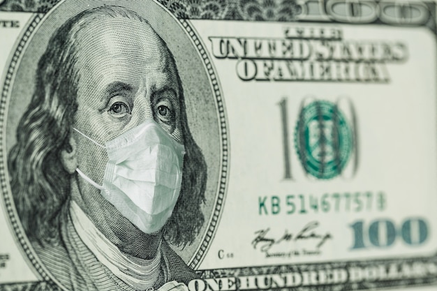 Premium Photo Portrait Of Benjamin Franklin 100 Dollar Bills With A Medical Mask From The Coronavirus Covid 19