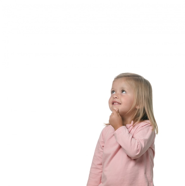 Premium Photo Portrait Of A Blonde Little Girl Pensive On The White Background