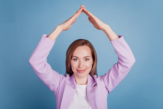 Premium Photo | Portrait of businesswoman holding two hands above head ...