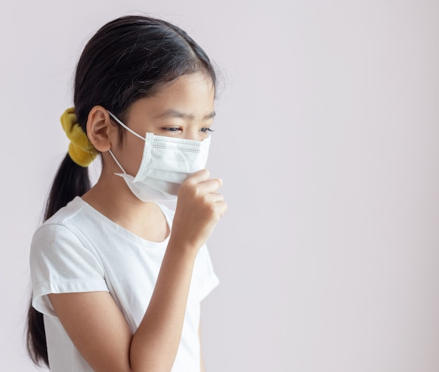 Premium Photo | Portrait of children wearing sanitary masks and coughs