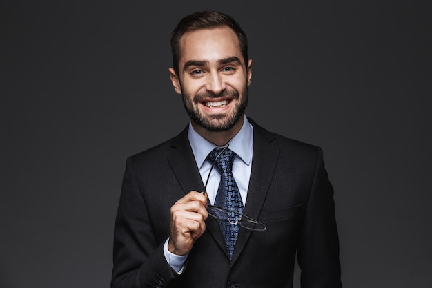 Premium Photo Portrait Of A Confident Handsome Businessman Wearing A Suit Standing Isolated 2833