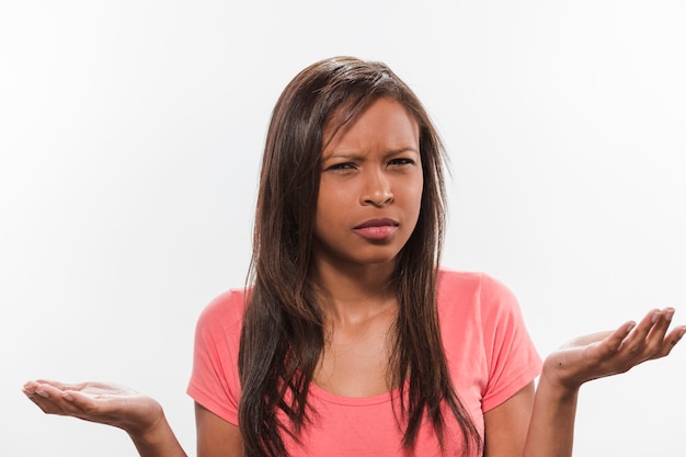 Portrait of a confused african teenage girl | Free Photo