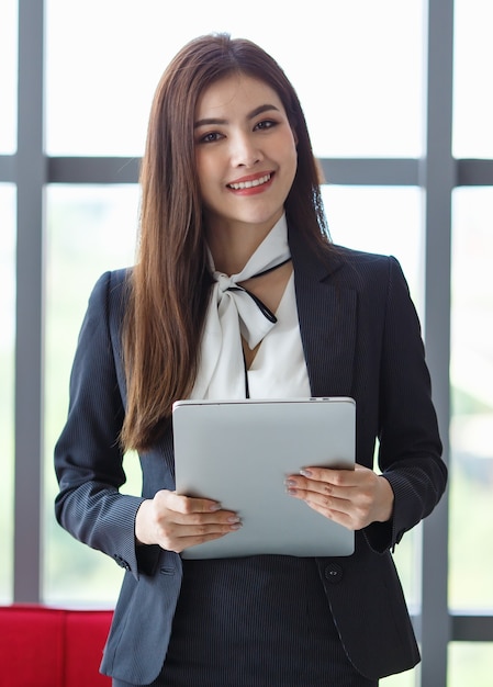 Premium Photo Portrait Of Content Asian Female Entrepreneur Or Secretary In Elegant Suit