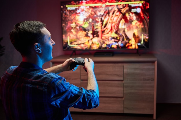 Premium Photo | Portrait of crazy playful gamer enjoying playing video ...