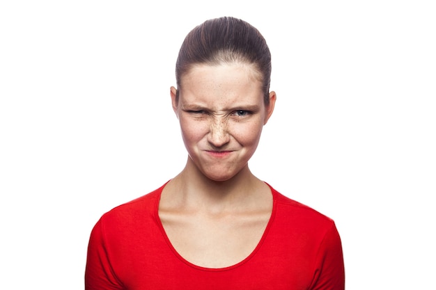 Premium Photo Portrait Of Cunning Woman In Red Tshirt With Freckles Looking At Camera 5602