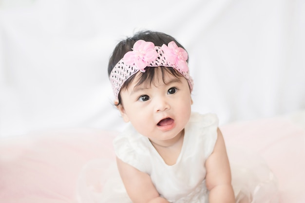 cute baby in white dress