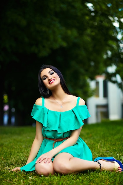 Free Photo Portrait Of Cute Funny Sexy Young Stylish Smiling Woman Girl Model In Bright Modern Green Dress With Perfect Sunbathed Body Outdoors In The Park