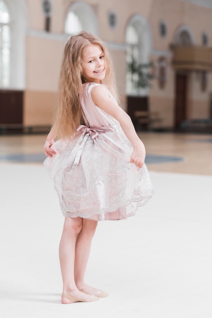 Portrait of cute little ballerina girl