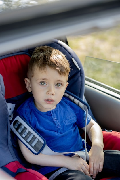 Premium Photo Portrait Of Cute Toddler Boy Sitting In Car Seat Child Transportation Safety
