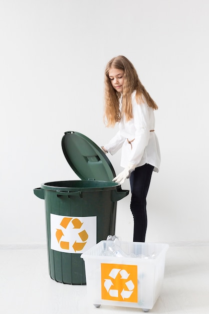 Free Photo | Portrait of cute young girl recycling