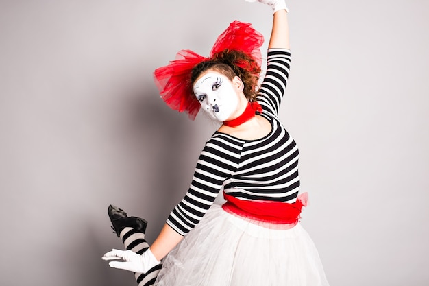 Premium Photo | Portrait of a dancing woman mime, april fools day