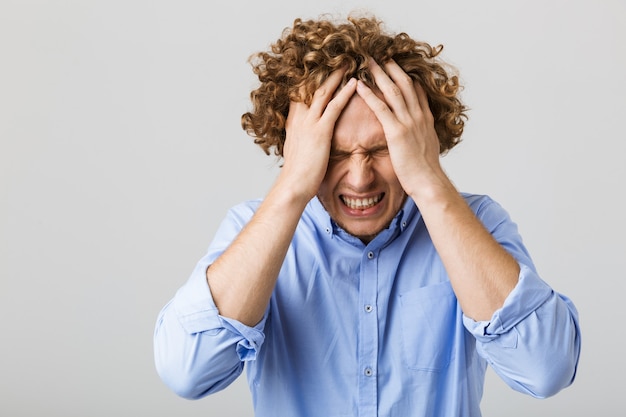 premium-photo-portrait-of-a-desperate-young-man-wearing-shirt