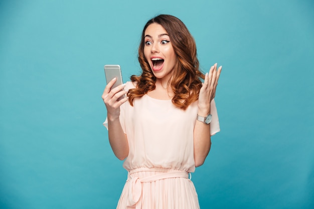 Premium Photo | Portrait of an excited beautiful girl wearing dress