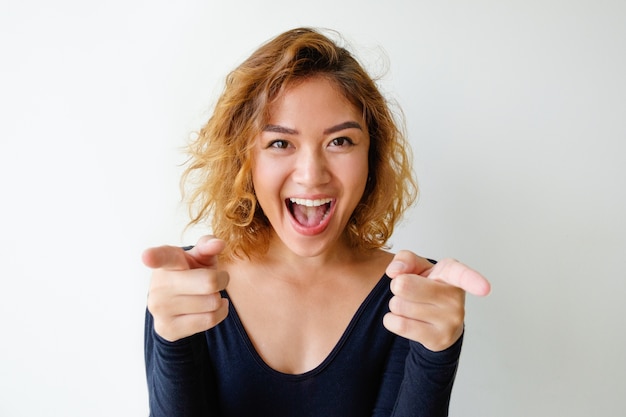 portrait-excited-young-woman-pointing-camera_1262-7259.jpg