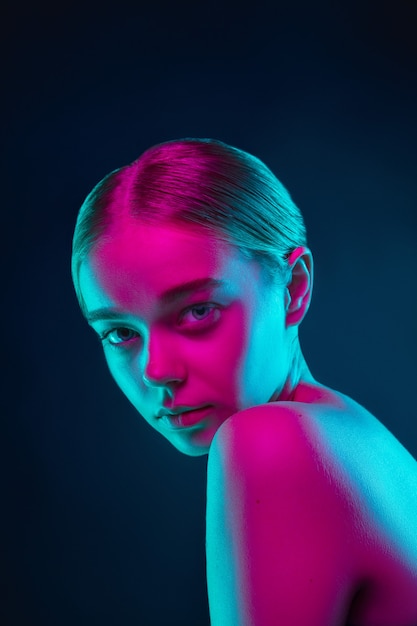 Free Photo Portrait Of Female Fashion Model In Neon Light On Dark Studio