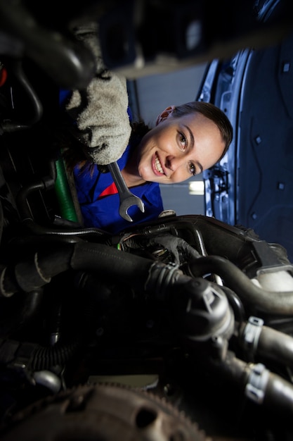 Portrait Of Female Mechanic Examin