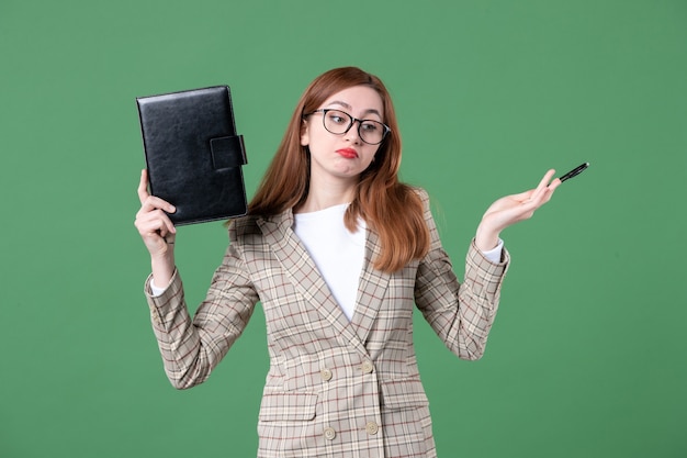  Free  Photo  Portrait  of female teacher holding notepad on 