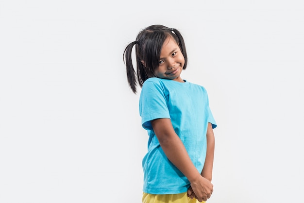 Portrait of funny little girl acting in studio shot | Free Photo