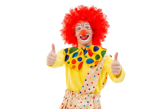 Portrait Of Funny Playful Clown In Red Wig Showing Ok Sign. 