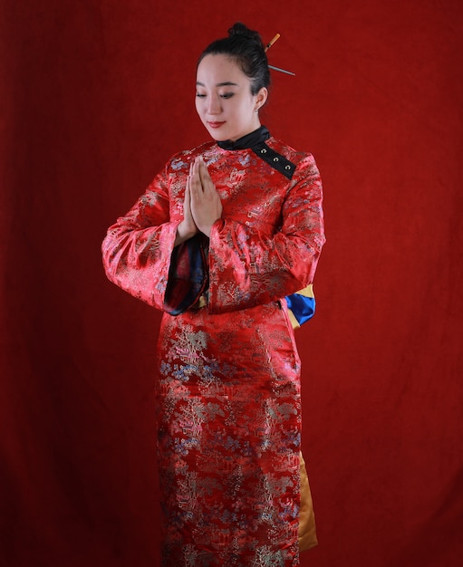 Premium Photo | Portrait of a geisha girl on a red background