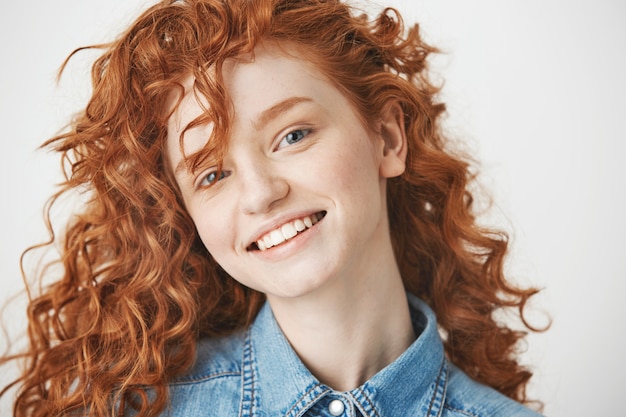 Free Photo | Portrait of ginger cheerful girl smiling