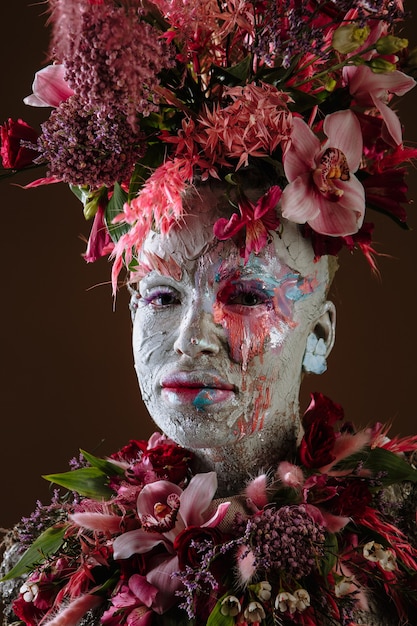 Premium Photo | Portrait of a girl smeared with clay in a cemented ...