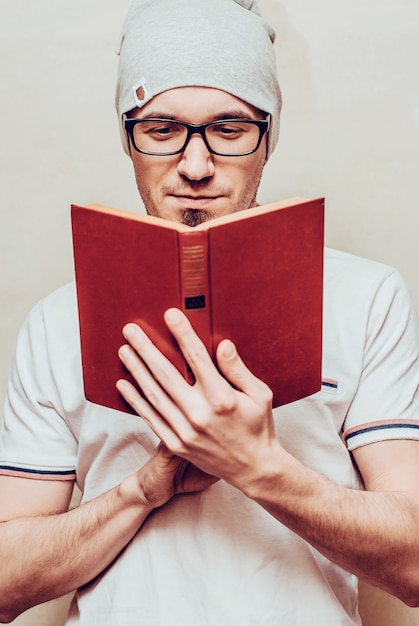 Premium Photo Portrait Of Handsome Bearded Man Reading A Book