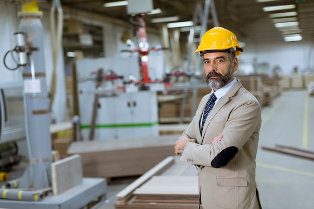 Premium Photo | Portrait of handsome businessman in suit with helmet in ...