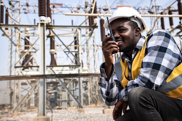 Premium Photo | Portrait of handsome engineering man using walkie ...