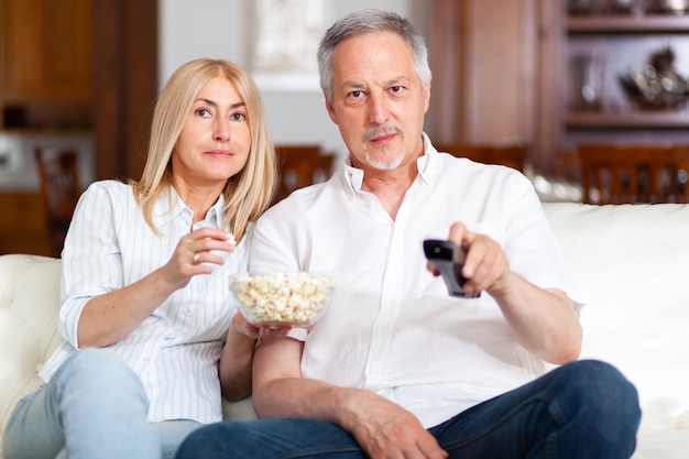 Premium Photo | Portrait of a happy mature couple in their home ...