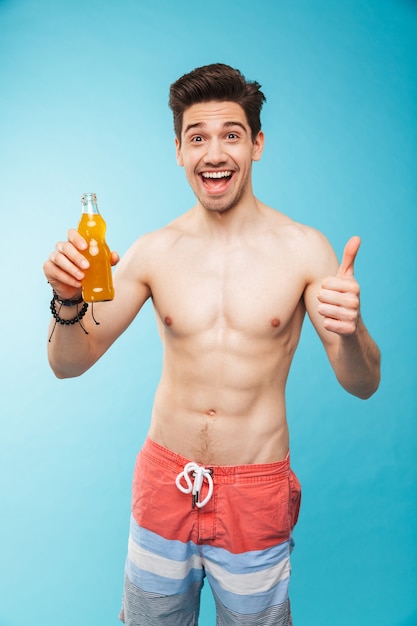 Premium Photo Portrait If A Cheerful Shirtless Man Showing Beer Bottle