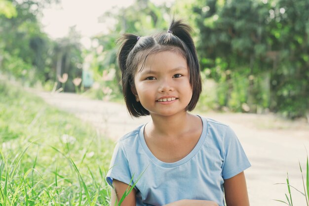 Premium Photo | Portrait little girl smiling in park