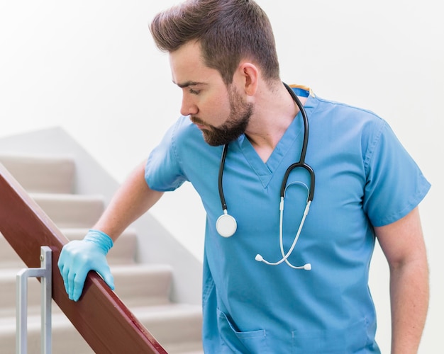 Free Photo Portrait Of Male Nurse Wearing Surgical Gloves