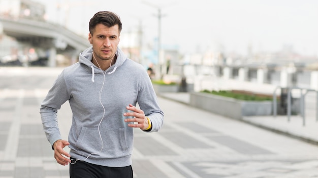 Portrait of male running outdoors | Free Photo