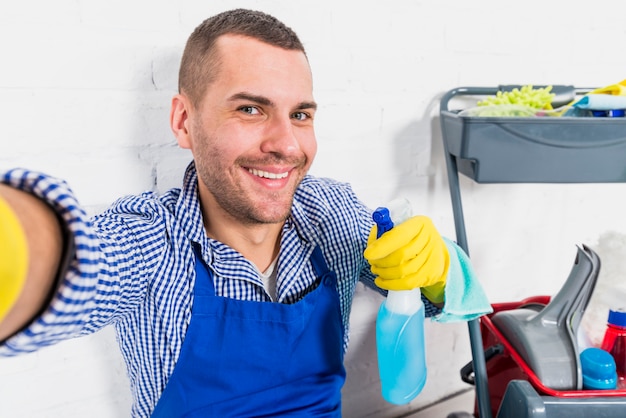 Free Photo | Portrait of man cleaning his house