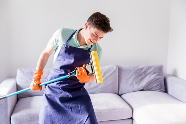 Free Photo | Portrait of man cleaning his house