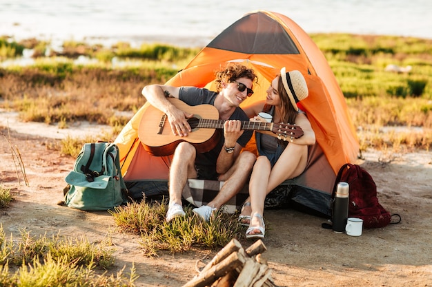 Premium Photo | Portrait of a man playing guitar for his girlfriend ...