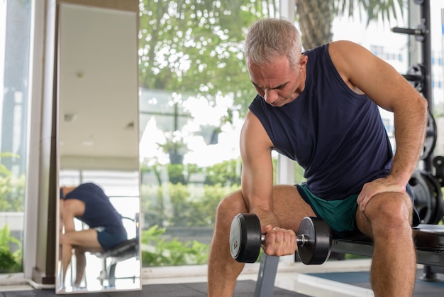 Premium Photo | Portrait of mature handsome persian man with gray hair ...