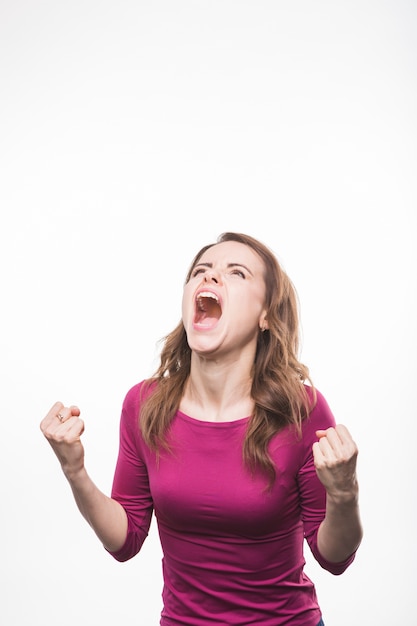 Portrait of a frustrated young woman over white backdrop Free Photo