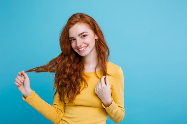 Portrait of happy ginger red hair girl with freckles smiling looking at ...