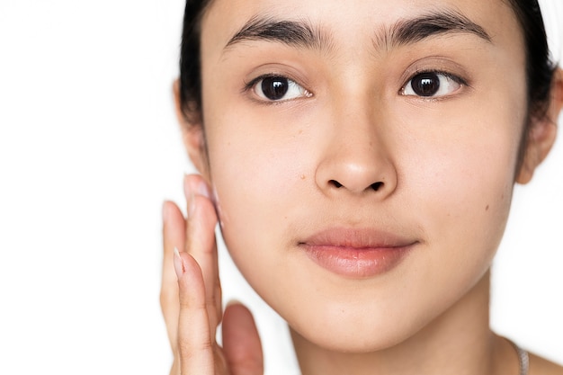 Portrait of white woman doing her daily skincare routine Free Photo