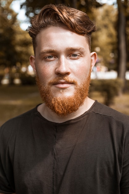 Portrait Of A Redhead Young Man With A Beard And Stylish Haircut