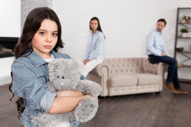 girl holding a teddy bear