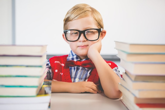 Premium Photo | Portrait of schoolkid pretending to be a teacher in ...