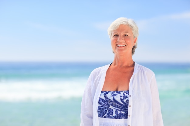 Premium Photo | Portrait of a senior woman on the beach