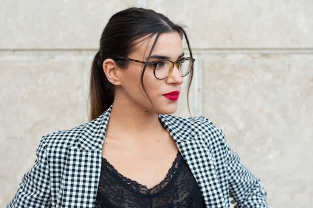 Premium Photo Portrait Of A Sensual Young Brunette Secretary With Red Painted Lips And Glasses