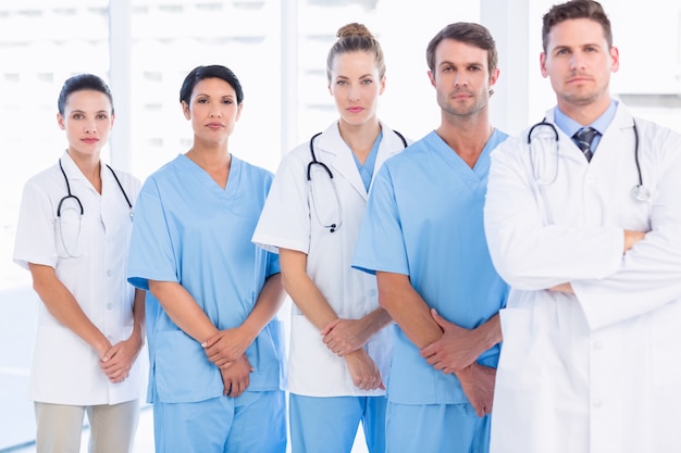 Premium Photo | Portrait of serious confident group of doctors